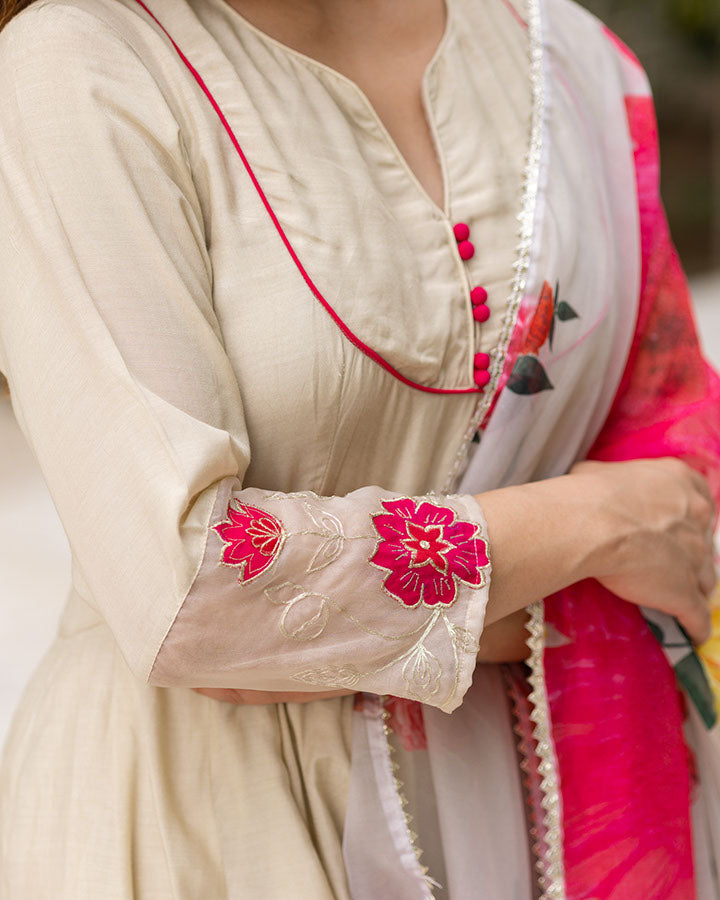 Beige muslin suit set with elegant patchwork