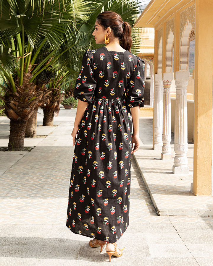 Elegant black maxi dress adorned with floral patterns
